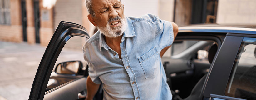 patient with back pain in need of auto accident injury care in Louisville
